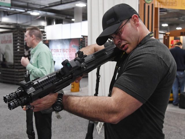 Thomas Larosa of Texas looks at a Standard Manufacturing Co. DP-12 double pump-action shotgun at the 2018 National Shooting Sports Foundation's Shooting, Hunting, Outdoor Trade (SHOT) Show at the Sands Expo and Convention Center on January 23, 2018 in Las Vegas, Nevada. The SHOT Show, the world's largest annual trade …