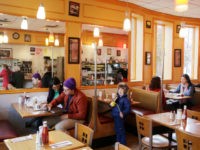 Customers sit in Little Purity restaurant in the Park Slope neighborhood in the Brooklyn borough of New York that Mayor-elect Bill de Blasio calls home, Thursday, Nov. 14, 2013. Now de Blasio faces a crucial early decision: should he leave Park Slope behind to move to the mayor’s official residence, …