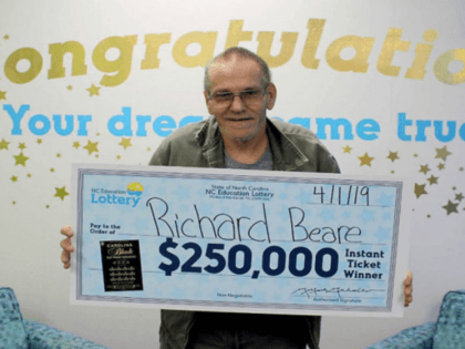 Richard Beare collects his big prize. North Carolina Education Lottery