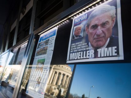 Newspaper front pages from around the nation are on display at the Newseum Saturday, March 23, 2019, in Washington. Special counsel Robert Mueller closed his long and contentious Russia investigation with no new charges, ending the probe that has cast a dark shadow over Donald Trump's presidency. (AP Photo/Alex Brandon)