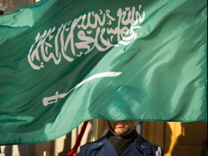 In this March 22, 2018 file photo, an Honor Guard member is covered by the flag of Saudi Arabia as Defense Secretary Jim Mattis welcomes Saudi Crown Prince Mohammed bin Salman to the Pentagon with an Honor Cordon, in Washington Saudi Arabia’s Interior Ministry said Tuesday, April 23, 2019, that …