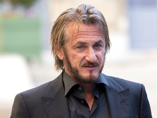 US actor Sean Penn listens to French minister for Ecology, Sustainable Development and Ene