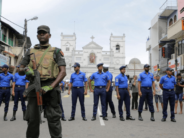 Sri Lankan Army soldiers secure the area around St. Anthony's Shrine after a blast in Colo