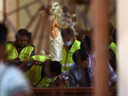 Security personnel inspect inside St. Sebastian's Church in Negombo on April 22, 2019, a day after the church was hit in series of bomb blasts targeting churches and luxury hotels in Sri Lanka. - The death toll from bomb blasts that ripped through churches and luxury hotels in Sri Lanka …