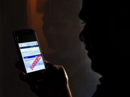A Sri Lankan man mobile phone user shows an image on Twitter showing that the Facebook sit
