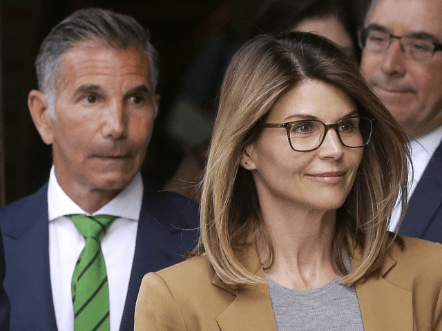 FILE - In this April 3, 2019 file photo, actress Lori Loughlin, front, and husband, clothi