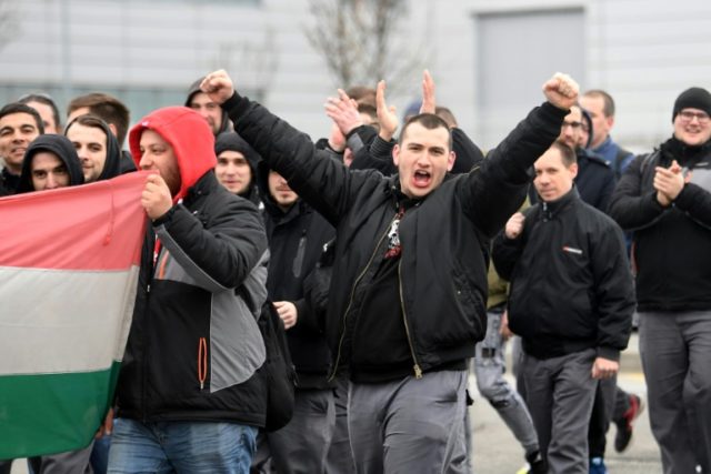 Employees on strike outside the plant of Korean-owned tire-maker Hankook in Hungary, where unions have seen a string of successes this year Hungarian trade unions bare teeth in rare strike wave