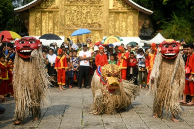 Masked merriment: Sacred Laos 'ancestors' honoured for new year