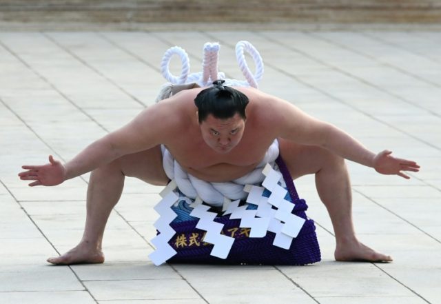 Slapped for a clap: Sumo champ Hakuho dressed down for '3 cheers'