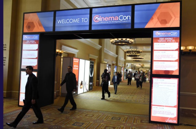 CinemaCon This April 26, 2018, file photo shows CinemaCon attendees walking through the lobby during CinemaCon 2018 in Las Vegas, the official convention of the National Association of Theatre Owners. The movie industry, everyone from the Hollywood studios that produce the films to the companies that make the screens, speakers and seats in theaters, are descending on Las Vegas this week for CinemaCon. (Photo by Chris Pizzello/Invision/AP, File) The Associated Press