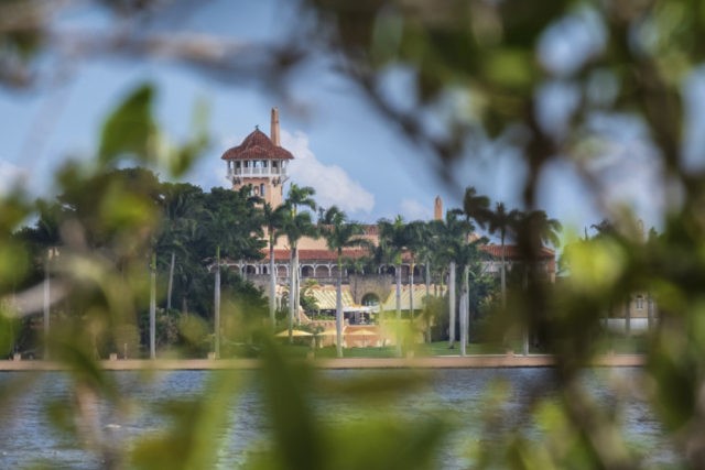 Trump Mar a Lago Arrest This Nov. 23, 2018 file photo shows President Donald Trump's Mar a Lago estate behind mangrove trees in Palm Beach, Fla. On Saturday, March 30, 2019, a woman carrying two Chinese passports and a device containing computer malware lied to Secret Service agents and briefly gained admission to the club over the weekend during his Florida visit, federal prosecutors allege in court documents. (AP Photo/J. David Ake) The Associated Press