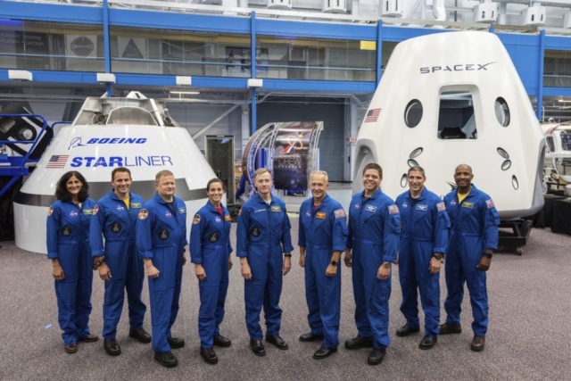 Space Commercial Crew This undated photo made available by NASA on Aug. 3, 2018 shows mockups of Boeing's CST 100 Starliner and SpaceX's Crew Dragon capsules with crew members, from left, Sunita Williams, Josh Cassada, Eric Boe, Nicole Mann, Christopher Ferguson, Douglas Hurley, Robert Behnken, Michael Hopkins and Victor Glover at the Johnson Space Center in Texas. Boe, pulled for unspecified medical reasons in January 2019, was replaced by Mike Fincke. The Starliner capsule, supposed to make its debut in April 2019, was pushed back until August. SpaceX’s Dragon capsule could fly with a test crew in the summer of 2019, but the schedule is under review. (NASA via AP) The Associated Press