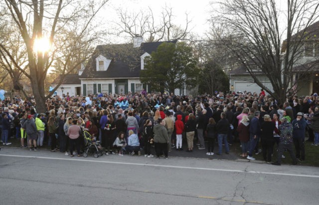 APTOPIX Missing Boy Illinois Mourners gather outside the home of 5 year old Andrew "AJ" Freund for a vigil Wednesday, April 24, 2019, in Crystal Lake, Ill. Andrew's body was found in a wooded area in Woodstock Wednesday, and the boy's parents have been charged with his murder. (John J. Kim/Chicago Tribune via AP) The Associated Press