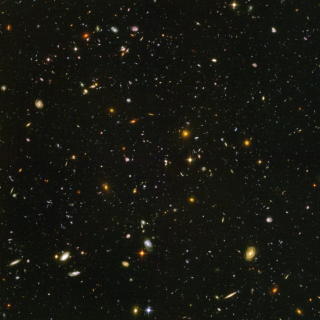 Space Expanding Cosmos This image made from a composite of September 2003 January 2004 photos captured by the NASA/ESA Hubble Space Telescope shows nearly 10,000 galaxies in the deepest visible light image of the cosmos, cutting across billions of light years. In research released on Friday, April 26, 2019, Nobel winning astronomer Adam Riess calculates the cosmos is between 12.5 and 13.0 billion years old about 1 billion years younger than previous estimates. (NASA, ESA, S. Beckwith (STScI), HUDF Team via AP) The Associated Press
