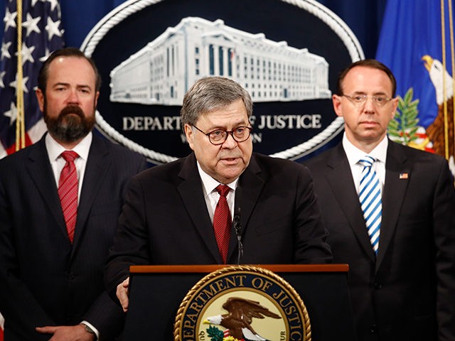 Attorney General William Barr speaks alongside Deputy Attorney General Rod Rosenstein, right and acting Principal Associate Deputy Attorney General Edward O’Callaghan, left, about the release of a redacted version of special counsel Robert Mueller's report during a news conference, Thursday, April 18, 2019, at the Department of Justice in Washington. …