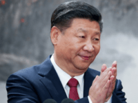 Chinese President Xi Jinping speaks at the podium during the unveiling of the Communist Party's new Politburo Standing Committee at the Great Hall of the People on October 25, 2017 in Beijing, China. China's ruling Communist Party today revealed the new Politburo Standing Committee after its 19th congress. (Photo by …