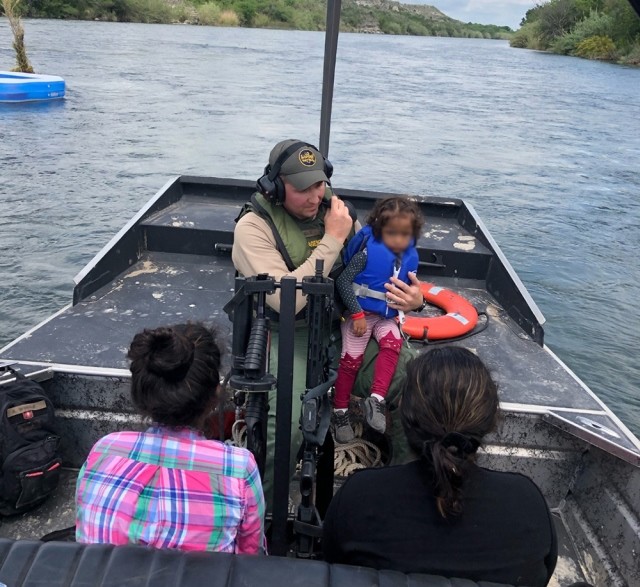 Del Rio Station marine agents rescue migrant family from a makeshift raft that became stranded in the Rio Grande. (Photo: U.S. Border Patrol/Del Rio Sector)