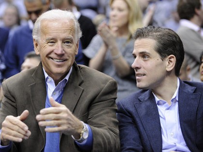 Vice President Joe Biden, left, with his son Hunter, right, at the Duke Georgetown NCAA co