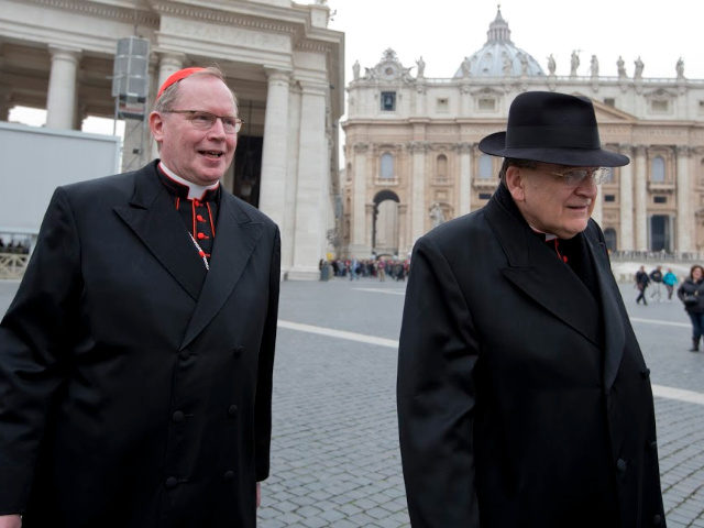 Cardinal Willem Jacobus Eijk, left, of the Netherlands, and US Cardinal Raymond Leo Burke leave at the end of a meeting, at the Vatican, Tuesday, March 5, 2013. The Sistine Chapel closed to visitors on Tuesday and construction work got under way to prepare it for the conclave, but five …
