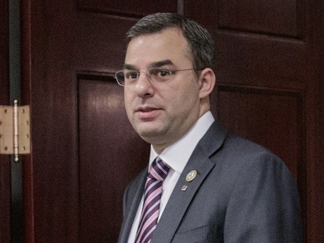 FILE - This March 28, 2017, file photo shows Rep. Justin Amash, R-Mich., followed by Rep.