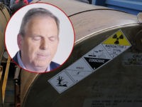 (INSET: John Weaver) Representatives of participating companies gather at the containers with uranium, before they are loaded on a vessel, on a port in St. Petersburg, Russia, Thursday, Nov. 14, 2013. A 20-year program to convert highly enriched uranium from dismantled Russian nuclear weapons into fuel for U.S. power plants …