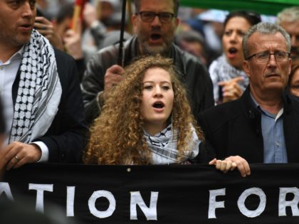 Palestinian activist Ahed Tamimi (C) joins a march calling for justice for Palestinians amid a growing threat of further war in the Middle East moves through the London streets of central London on May 11, 2019. (Photo by Daniel LEAL-OLIVAS / AFP) (Photo credit should read DANIEL LEAL-OLIVAS/AFP/Getty Images)