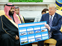 US President Donald Trump (R) holds a defence sales chart with Saudi Arabia's Crown Prince Mohammed bin Salman in the Oval Office of the White House on March 20, 2018 in Washington, DC. (Photo by MANDEL NGAN / AFP) (Photo credit should read MANDEL NGAN/AFP/Getty Images)