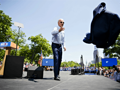 Democratic presidential candidate, former Vice President Joe Biden tosses his coat during