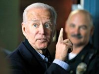 Former vice president and Democratic presidential candidate Joe Biden interacts with a supporter during a campaign stop at the Community Oven restaurant in Hampton, N.H., Monday, May 13, 2019. (AP Photo/Michael Dwyer)
