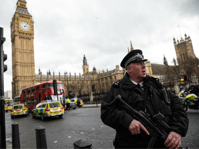 LONDON, ENGLAND - MARCH 22: An armed police officer stands guard near Westminster Bridge and the Houses of Parliament on March 22, 2017 in London, England. A police officer has been stabbed near to the British Parliament and the alleged assailant shot by armed police. Scotland Yard report they have …