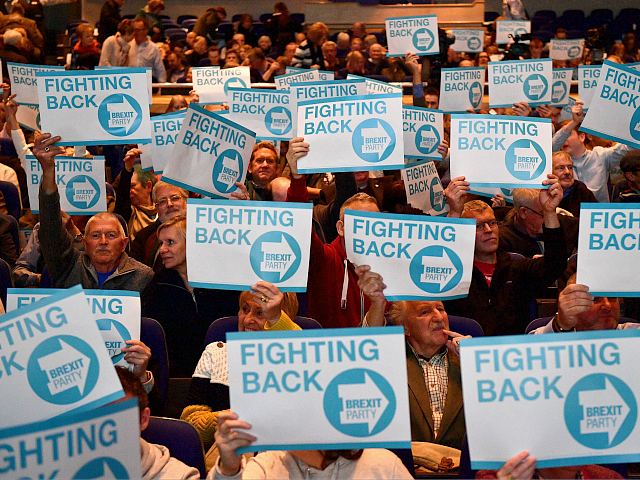 Supporters of The Brexit Party hold placards as they wait for the start of the first public rally of their European Parliament election campaign in Birmingham, central England on April 13, 2019. (Photo by Daniel LEAL-OLIVAS / AFP) (Photo credit should read DANIEL LEAL-OLIVAS/AFP/Getty Images)