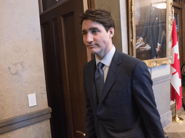 Canadian Prime Minister Justin Trudeau leaves after speaking to the press at Parliament Hi
