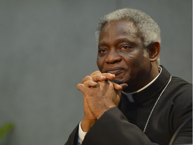 Ghanaian cardinal Peter Kodwo Appiah Turkson attends the signature of the "Global Freedom Network" agreement between representatives of Catholic church, the Anglican church and Sunni University Al-Azhar to fight against "modern forms of slavery and human trafficking," on March 17, 2014 at the Vatican. AFP PHOTO / ANDREAS SOLARO (Photo …