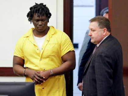 Emanuel Samson, left, enters the courtroom for a hearing Wednesday, Feb. 20, 2019, in Nashville, Tenn. Samson is accused of fatally shooting a woman and wounding six other people at a Tennessee church in September 2017. (AP Photo/Mark Humphrey)