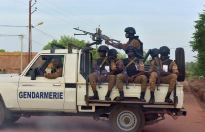 A picture take on October 30, 2018 shows Burkinabe gendarmes sitting on their vehicle in the city of Ouhigouya in the north of the country. - Two Burkinabe soldiers were killed and three wounded in the night of November 5, 2018 in Nassoumbou, northern Burkina Faso, near the Malian border, …