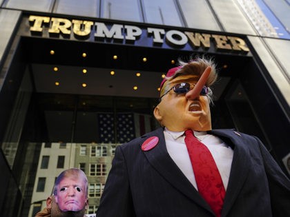 NEW YORK, NY - APRIL 1: Protestors wearing Donald Trump masks rally outside of Trump Tower during an April Fools' Day protest against U.S. President Donald Trump, April 1, 2019 in New York City. (Photo by Drew Angerer/Getty Images)
