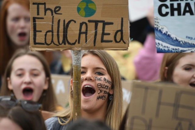 Supporters carry placards as they march during the YouthStrike4Climate demonstration in central London on April 12, 2019. (Photo by Daniel LEAL-OLIVAS / AFP) (Photo credit should read DANIEL LEAL-OLIVAS/AFP/Getty Images)