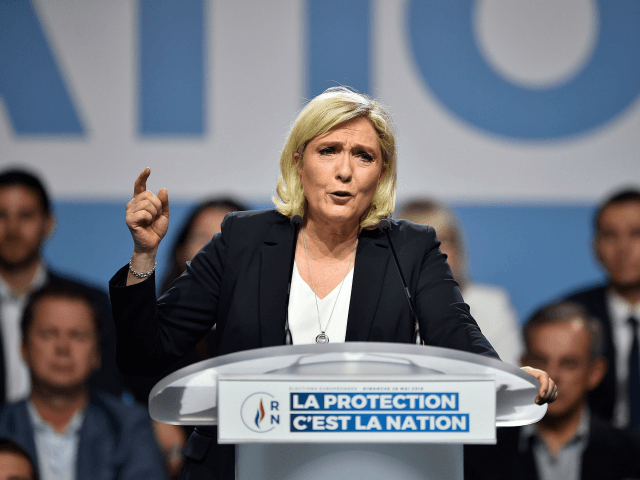 French far-right Rassemblement National (RN) party president Marine Le Pen gestures as she