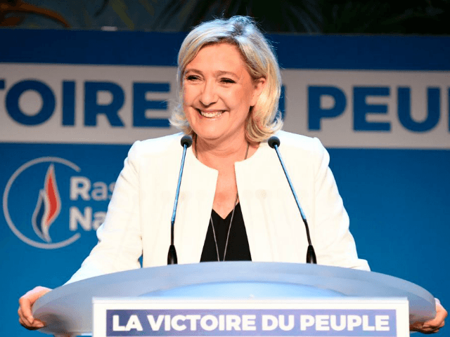 French far-right Rassemblement National (RN) President and member of Parliament Marine Le Pen delivers a speech after the announcement of initial results during an RN election-night event for European parliamentary elections on May 26, 2019, at La Palmeraie venue in Paris. (Photo by Bertrand GUAY / AFP) (Photo credit should …