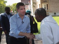 CHICAGO, ILLINOIS - MAY 22: Democratic presidential candidate Congressman Eric Swalwell (D-CA) greets residents during a brief walking tour of the city's southside before meeting with community activists to discuss ways to end gun violence on May 22, 2019 in Chicago, Illinois. Swalwell is one of more than 20 candidates …