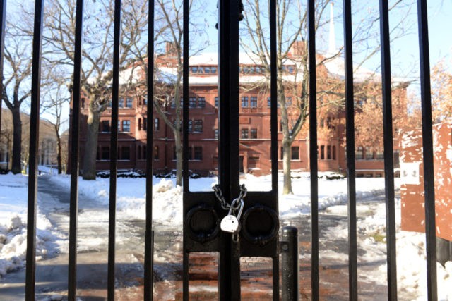 CAMBRIDGE, MA - DECEMBER 16: A gate sits locked on Quincy Street at Harvard University during a bomb scare December 16, 2013 in Cambridge, Massachusetts. Police were alerted at roughly nine thirty this morning of possible bombs at four different buildings on the Harvard campus. (Photo by Darren McCollester/Getty Images)