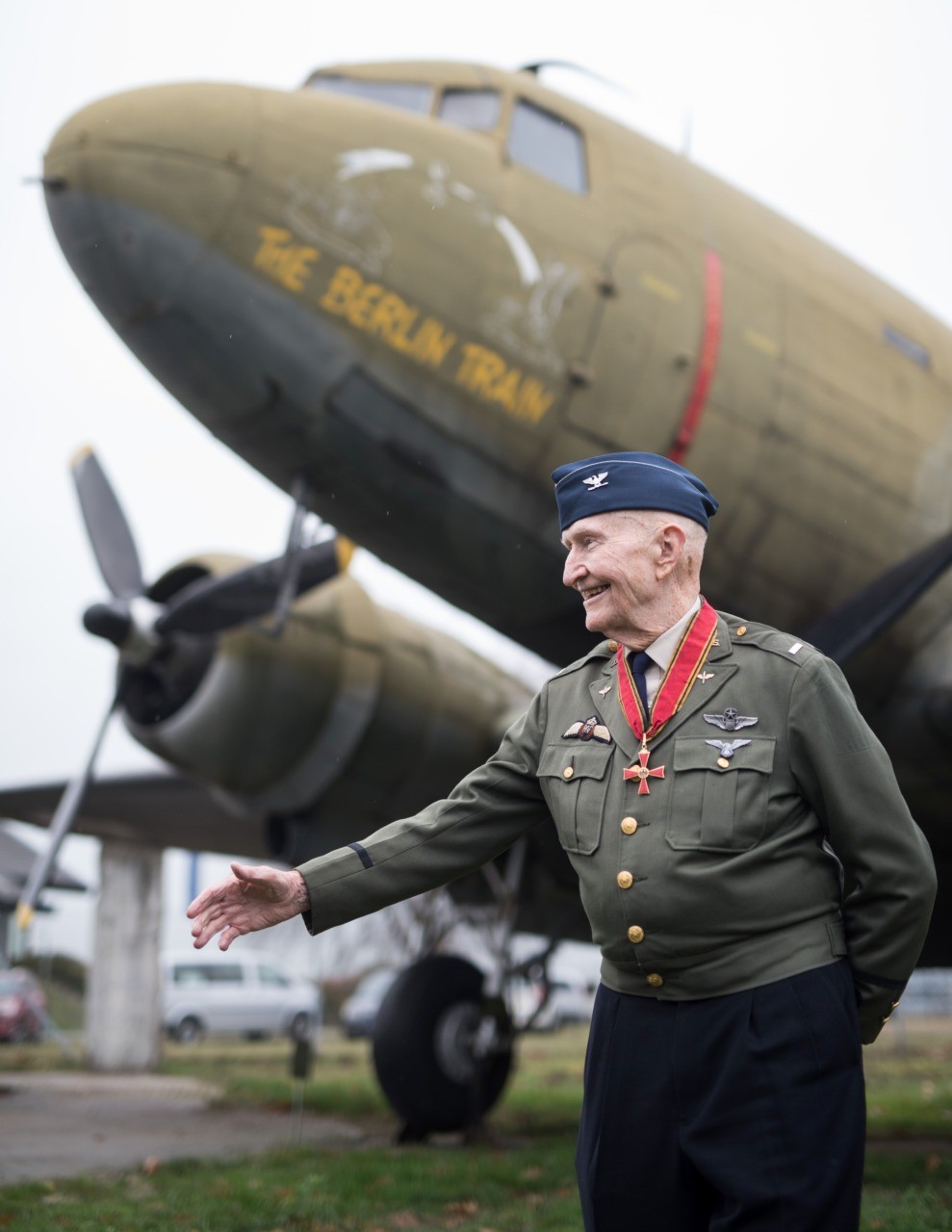 Veteran of the US Air Force and so-called "candy bombers" pilot Gail Halvorsen poses in front of a military transport aircraft at the airport in Frankfurt am Main, central Germany, on November 21, 2016. / AFP / dpa / Boris Roessler / Germany OUT (Photo credit should read BORIS ROESSLER/AFP/Getty Images)