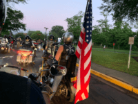 On Sunday before sunrise, they gathered at a hotel parking lot in Fairfax, Virginia just outside the Washington beltway. They checked engines, rolled into formations, revved engines, carried American flags. Around 5:30 a.m. they rolled out, towards the Pentagon staging ground.