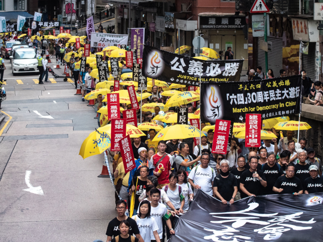 Pro-democracy activists attend a march in Hong Kong on May 26, 2019, to commemorate the Ju