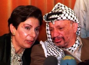 Hanan Ashrawi and Yasser Arafat (Jaques Demarthon / Getty)