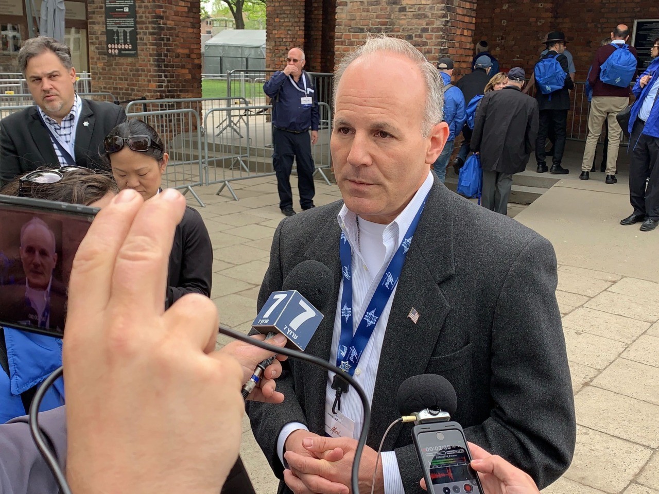 U.S. antisemitism envoy Elan Carr speaks to reporters at Auschwitz and praises President Trump’s record fighting antisemitism