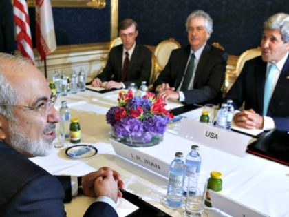 Iran's Foreign Minister Mohammad Javad Zarif (L) meets with US Secretary of State Joh