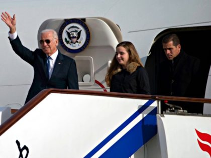 BEIJING, CHINA - DECEMBER 04: U.S. Vice President Joe Biden waves as he walks out of Air Force Two with his granddaughter Finnegan Biden and son Hunter Biden (R) on December 4, 2013 in Beijing, China. Biden is on the first leg of his week-long visit to Asia. (Photo by …