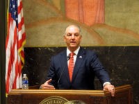 Gov. John Bel Edwards talks with supporters on the final day of the special session on taxes that he called to raise money for next year's budget, on Monday, June 4, 2018, in Baton Rouge, La. (AP Photo/Melinda Deslatte)
