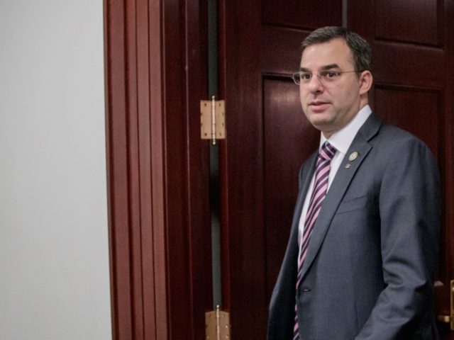 This March 28, 2017, file photo shows Rep. Justin Amash, R-Mich., followed by Rep. Jim Jordan, R-Ohio, leaving a closed-door strategy session with Speaker of the House Paul Ryan, R-Wis. A top aide to President Donald Trump is urging the primary defeat of a conservative House member from Michigan. A …